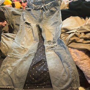 Blue ripped baggy jeans.